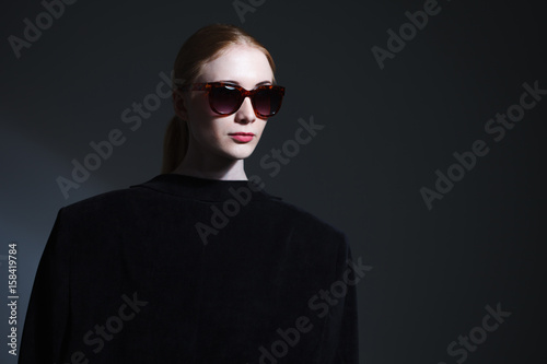 Fashion art studio portrait of elegant girl in geometric black and white background