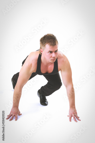 Full length portrait of a fitness man running isolated on a white background