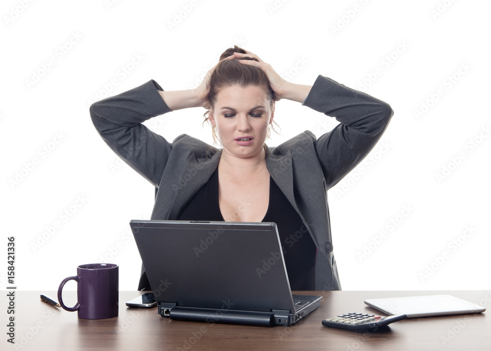 business woman at a desk stressed out business woman at a desk stressed out