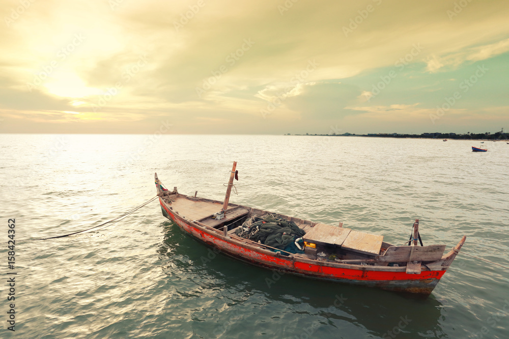 Old fishing boat on the sea coast of Thailand.