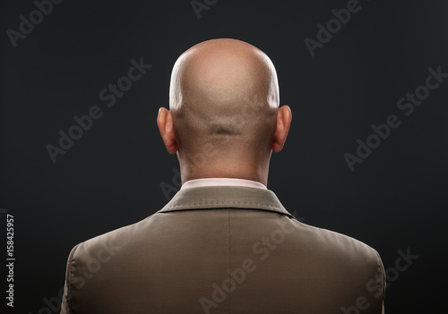 Fotografia The back of a bald man in suit