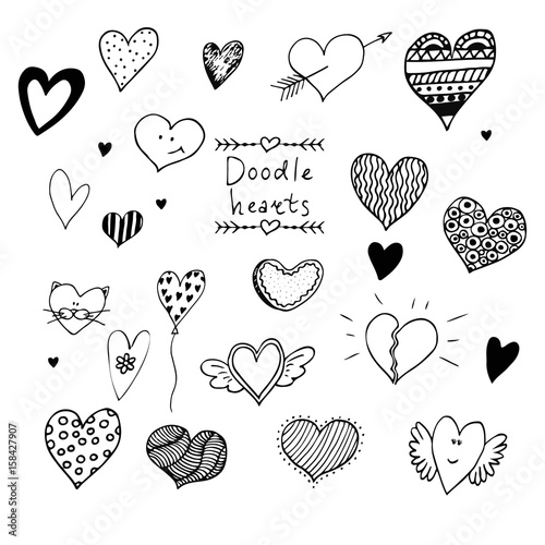 Set of hand drawn doodle vector hearts.