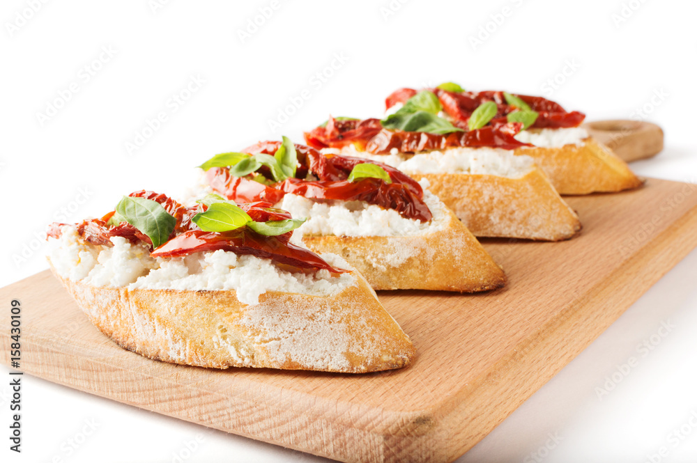 Italian sandwiches - bruschetta with cheese, tomato and basil Italian sandwiches - bruschetta with cheese, tomato and basil