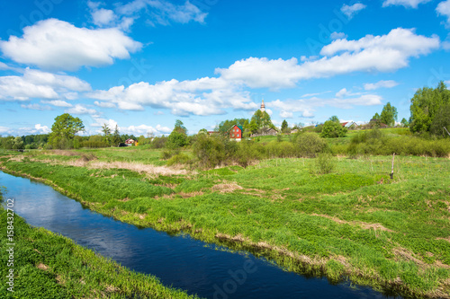 Panorama of the village of Mikhailovskoye in a Sunny spring day.