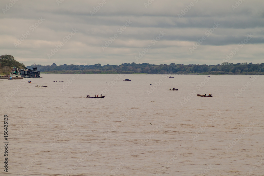TABATINGA, BRAZIL - JUNE 22, 2015: Traffic on river Amazon between Tabatinga (Brazil) and Santa Rosa (Peru)