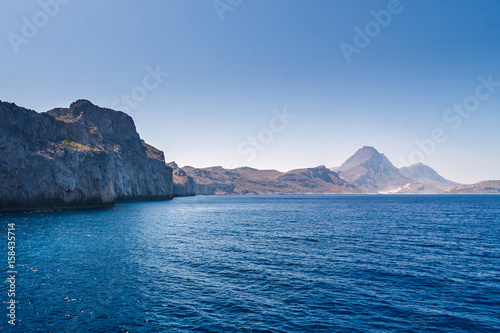 The calm sea with a mountain coast in the northwest of Crete, Greece © Viliam