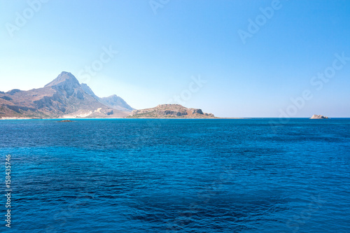 The calm sea with a mountain coast in the northwest of Crete, Greece © Viliam