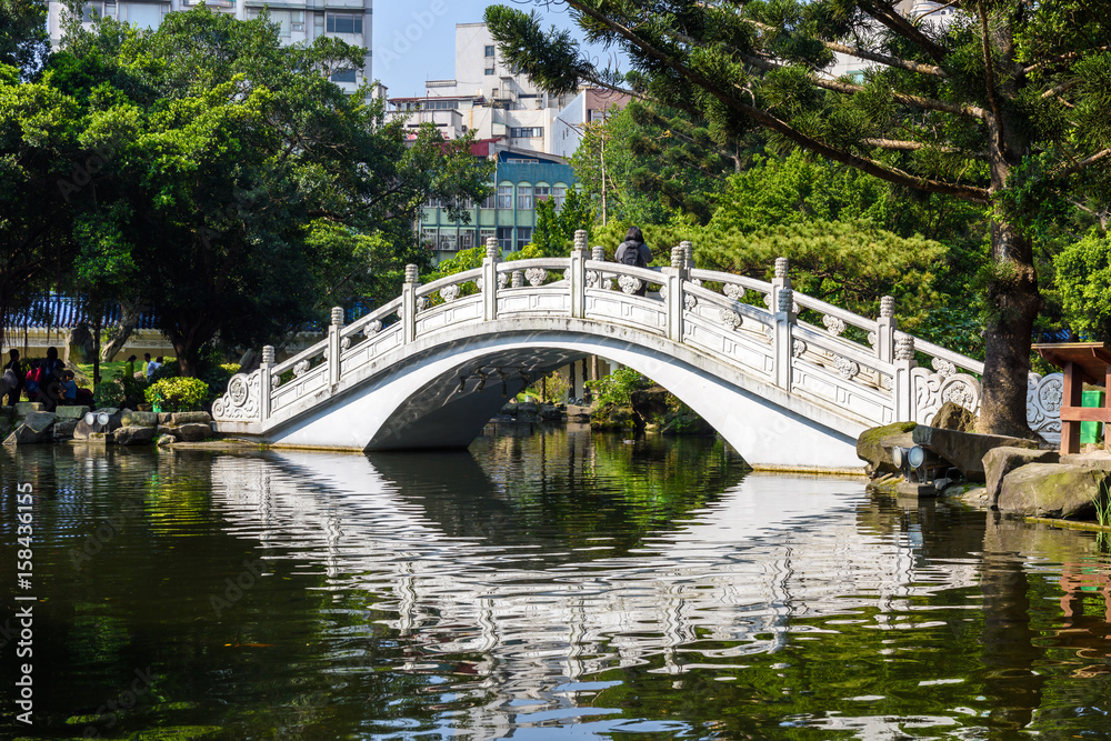Bridge and a pond on the grounds of the Chiang Kai Shek Memorial Hall in Taipei, Taiwan