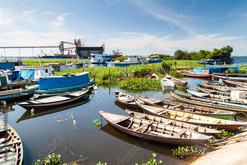 SANTAREM, BRAZIL - JULY 29, 2015: River boats anchored in a port of Santarem photo
