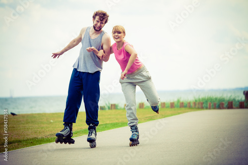 roller skater couple skating outdoor