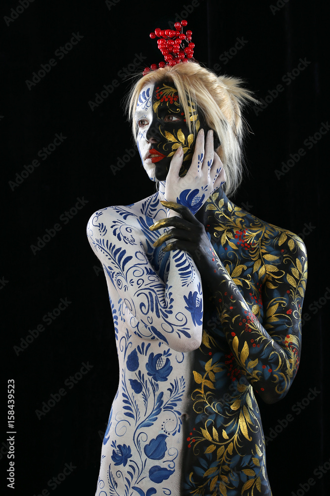 Fototapeta premium Body art of a girl in the style of Khokhloma and Gzhel