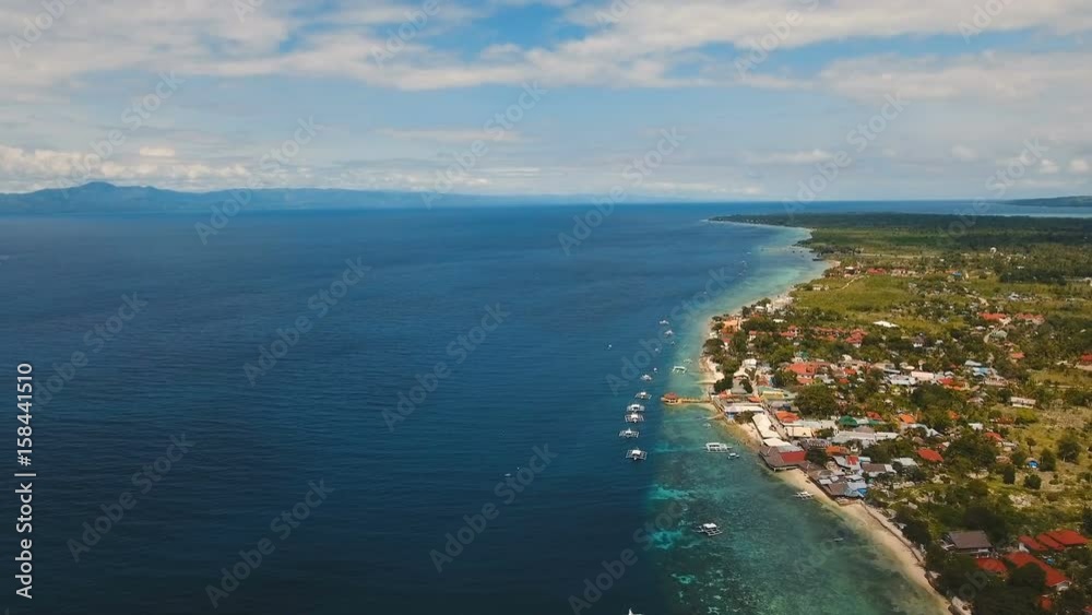 Aerial view of beautiful tropical island with white sand beach, boats, hotels and tourists. Tropical lagoon with turquoise water and white sand. Beautiful sky, sea, beach,mountains, resort. Seascape Aerial view of beautiful tropical island with white sand beach, boats, hotels and tourists. Tropical lagoon with turquoise water and white sand. Beautiful sky, sea, beach,mountains, resort. Seascape