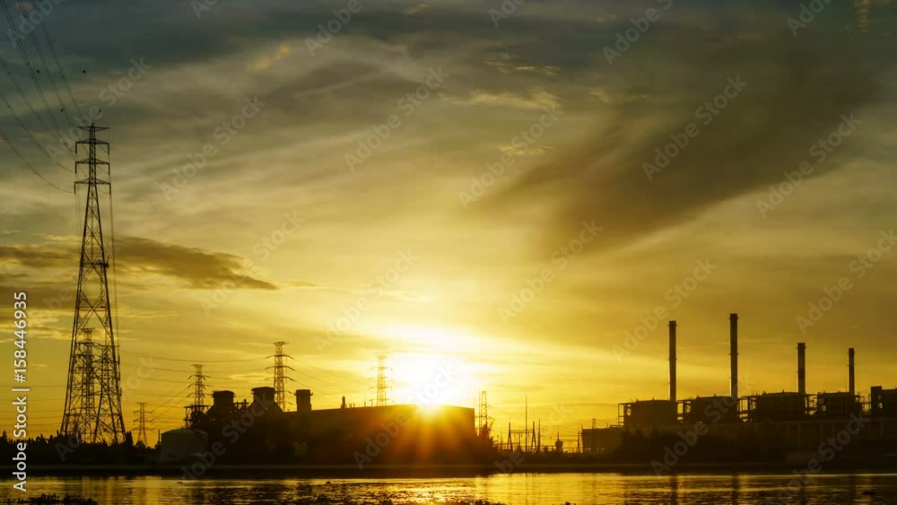 Time lapse shot of power plant at sunrise
