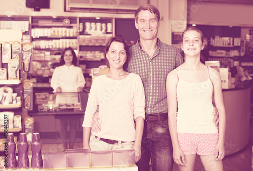 family in pharmaceutical store .