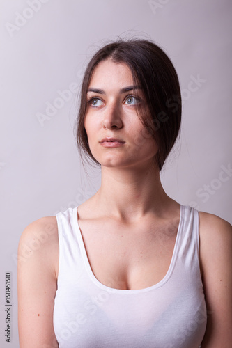 Portrait of beautiful woman wearing a white shirt. Sexy lady. Perfect beautiful attractive female posing in model test in studio