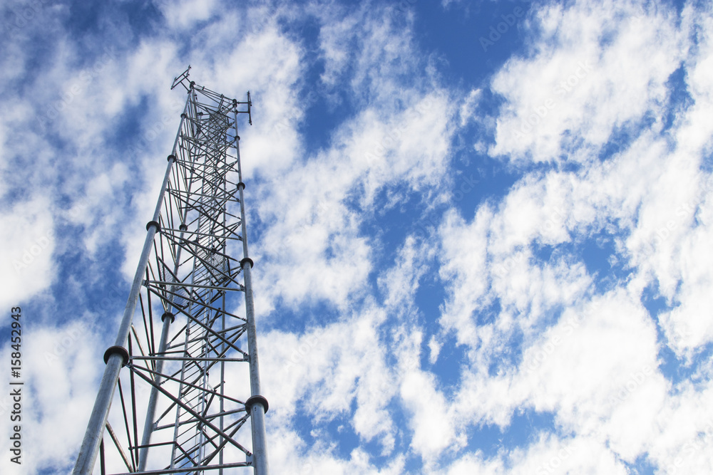 Telecommunication tower and antenna against the sky Telecommunication tower and antenna against the sky