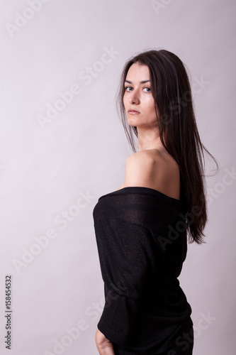 Sensual lady on gray background in studio photo. Sexy lady. Perfect beautiful attractive female posing in model test in studio