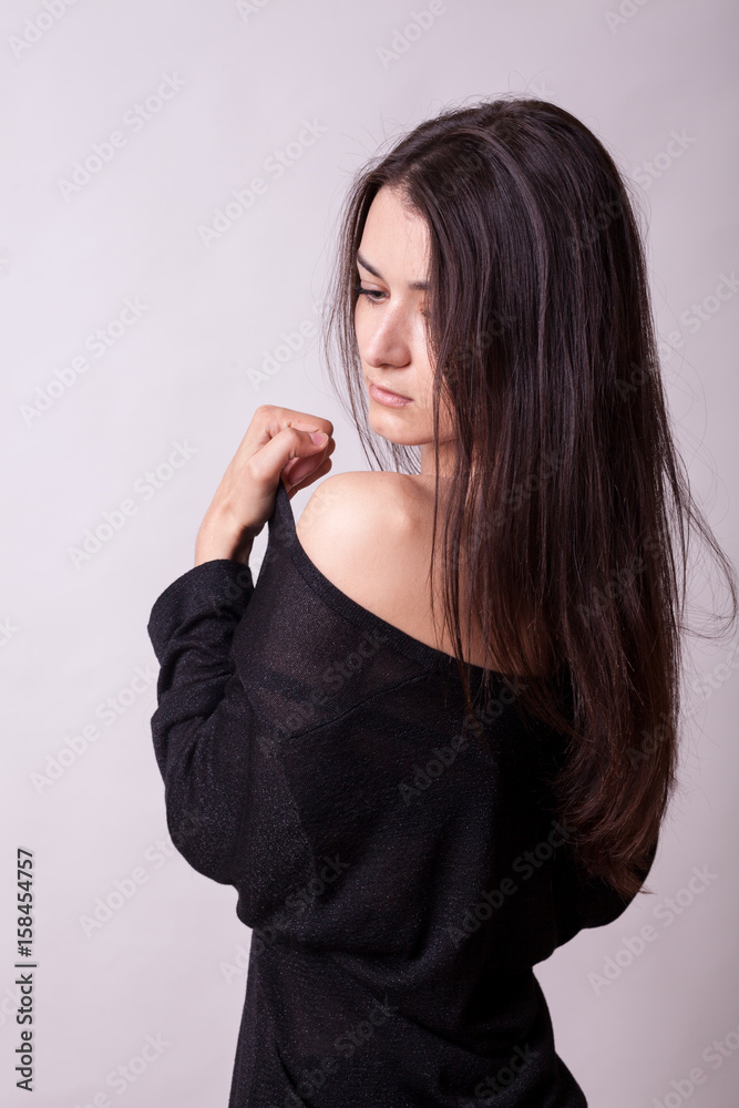 Beautiful woman on gray background. Sexy lady. Perfect beautiful attractive female posing in model test in studio Beautiful woman on gray background. Sexy lady. Perfect beautiful attractive female posing in model test in studio