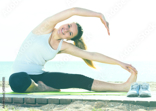 Woman doing yoga sitting