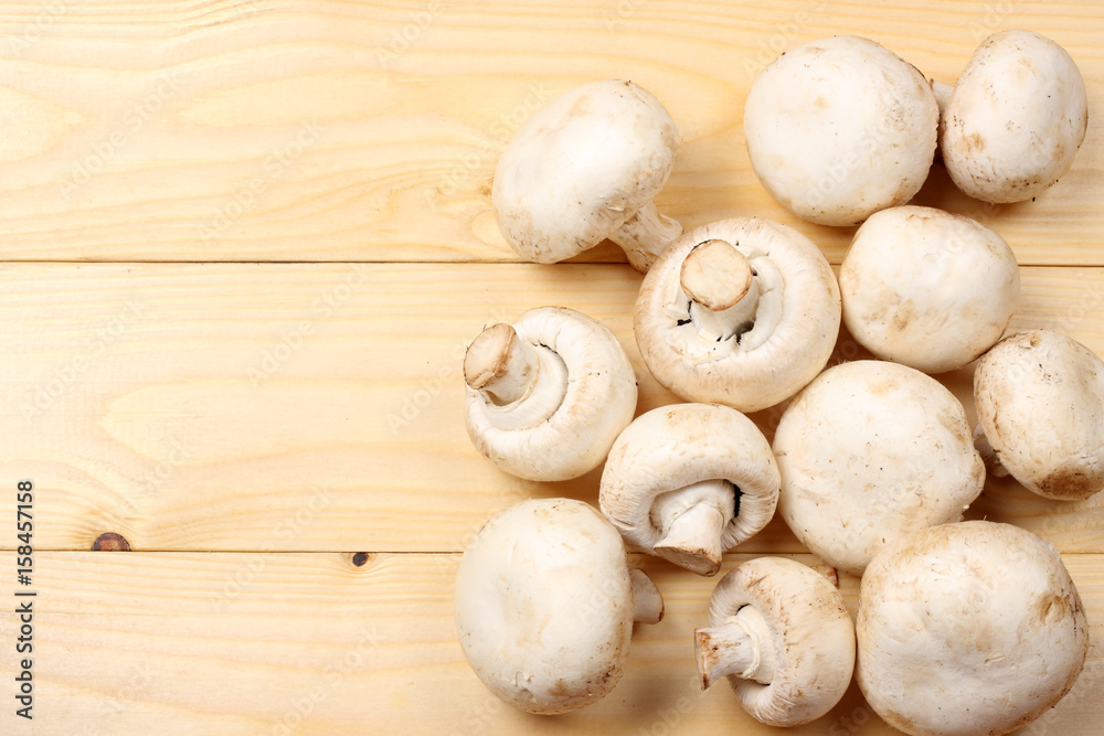 mushrooms on light wooden background. top view with copy space