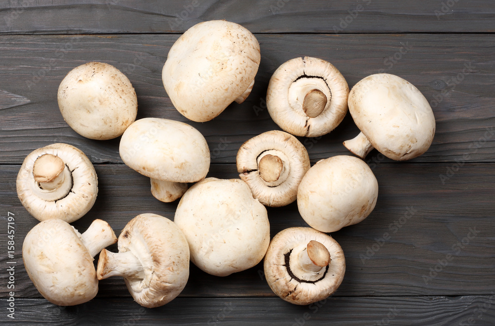 mushrooms on dark wooden background. top view with copy space mushrooms on dark wooden background. top view with copy space