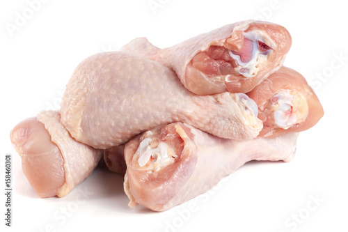 raw chicken drumsticks isolated on white background