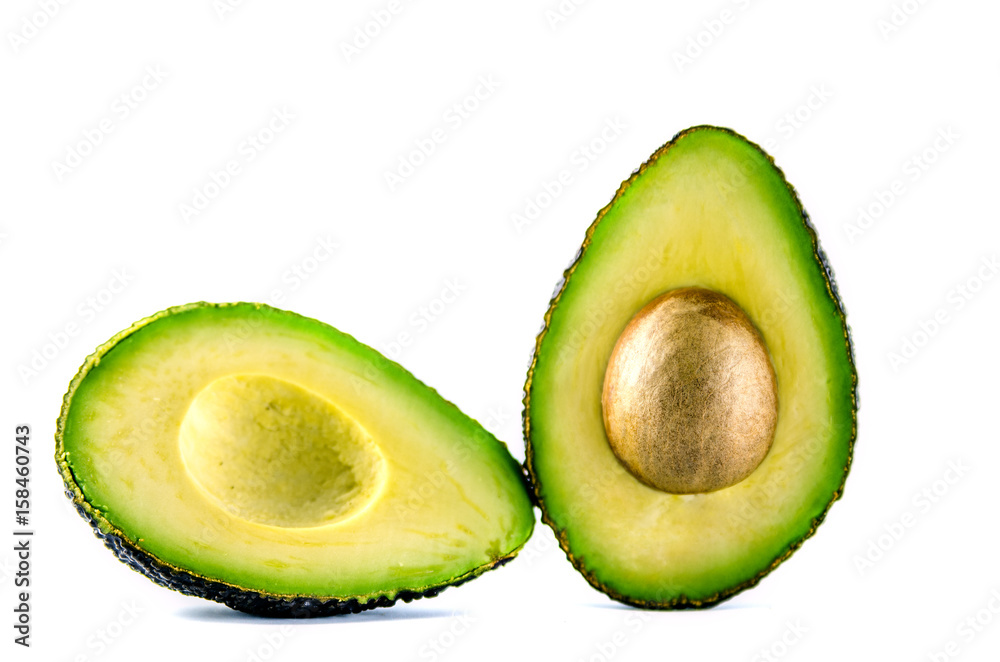 Two slices of avocado in a cut on a white background.