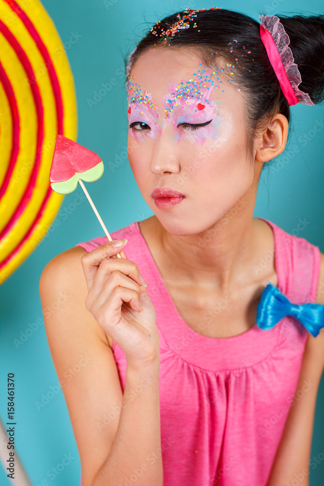 funny Korean girl with big colorful Lollipop Stock Photo | Adobe Stock