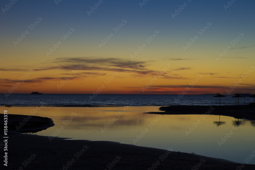 Sunset on the sea coast. Sunset background