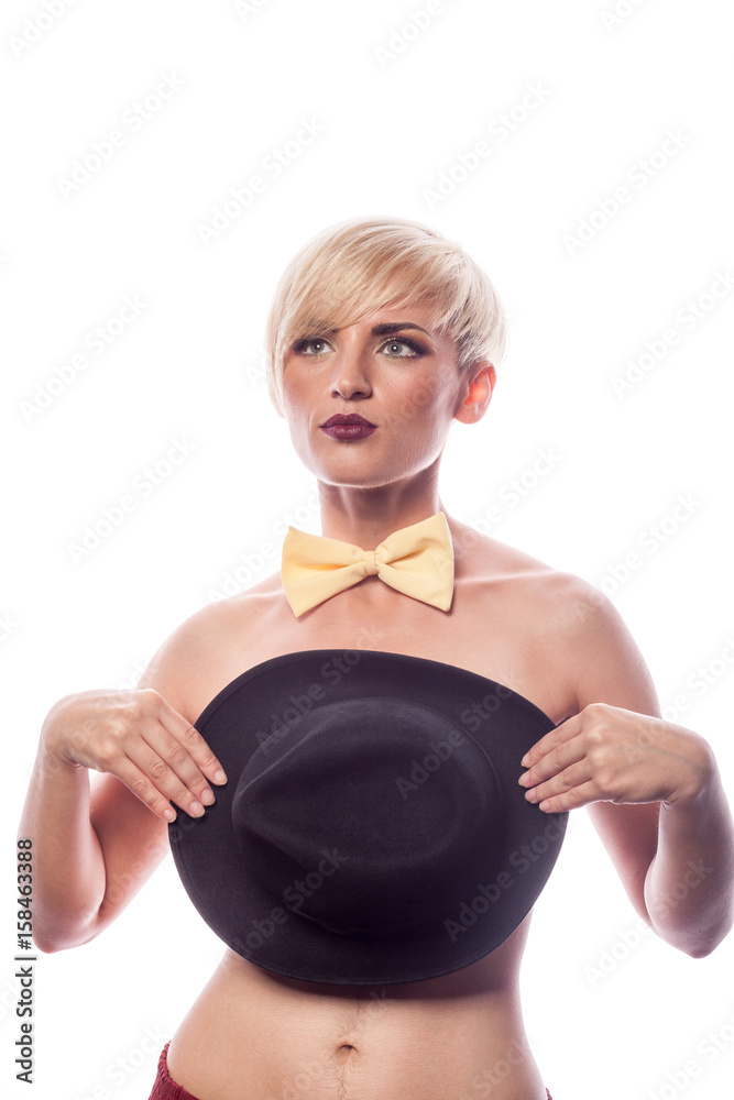 Sexy sensual gorgeous woman covering her breasts with a hat on white background in studio photo. Attractive lovely fashion model Sexy sensual gorgeous woman covering her breasts with a hat on white background in studio photo. Attractive lovely fashion model