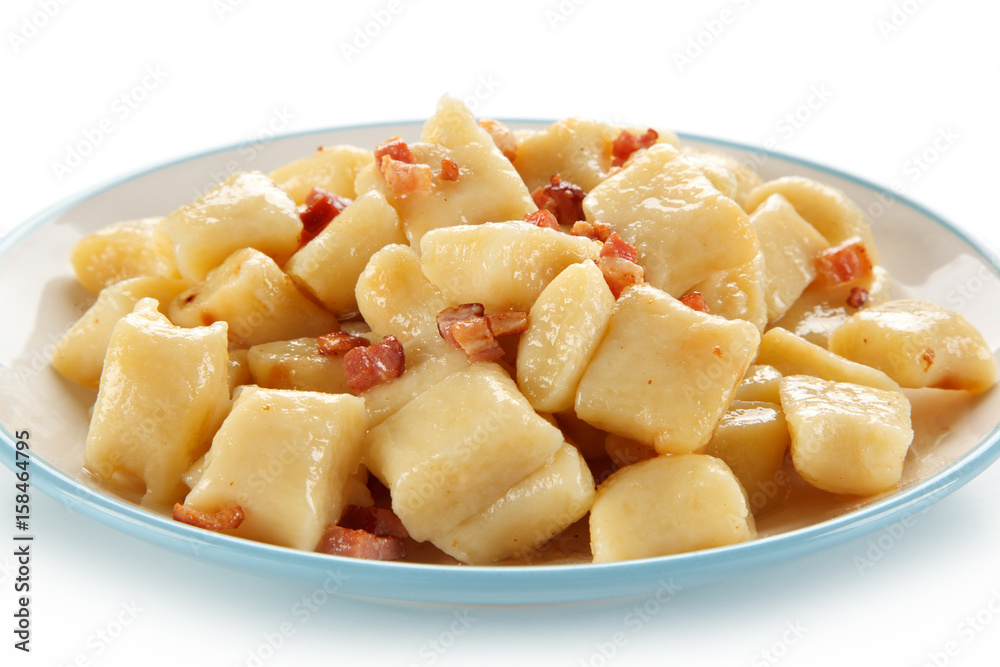 Potato noodles - dumplings on white background Potato noodles - dumplings on white background