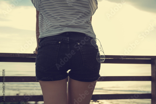 Attractive woman enjoying the view on the beach.