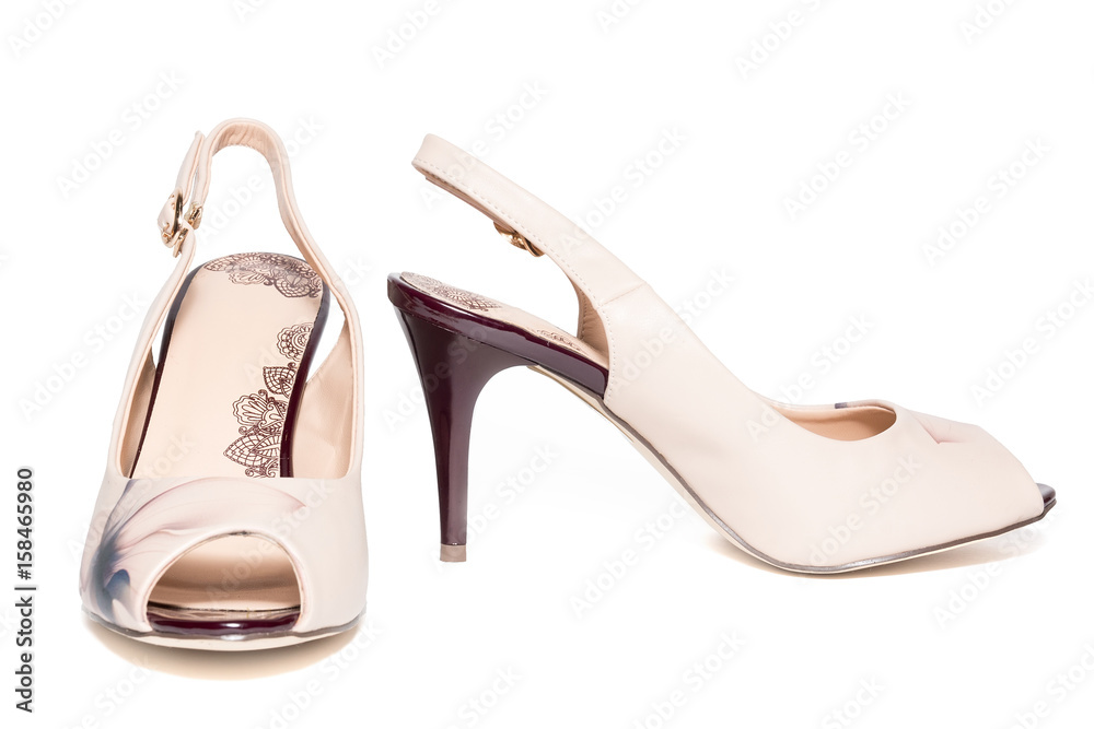 female beige shoes on a white background female beige shoes on a white background