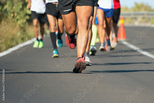 Marathon running race  people feet on city road