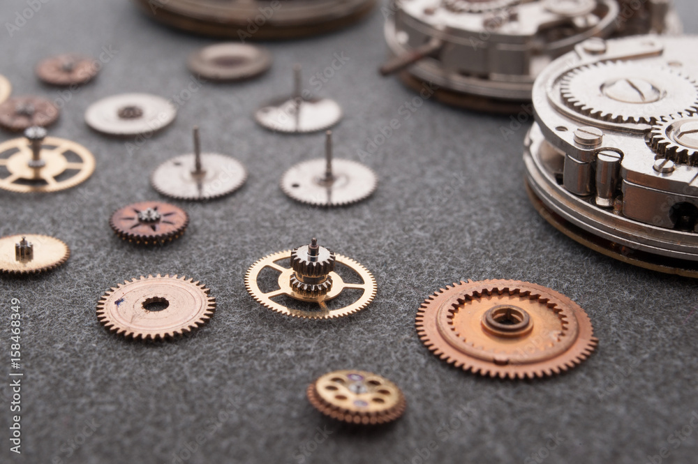 Detail of watch machinery on the table. Detail of watch machinery on the table.