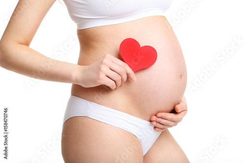 Pregnant woman with hearts over white background