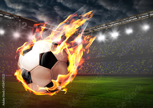 Soccer or football ball on fire at stadium