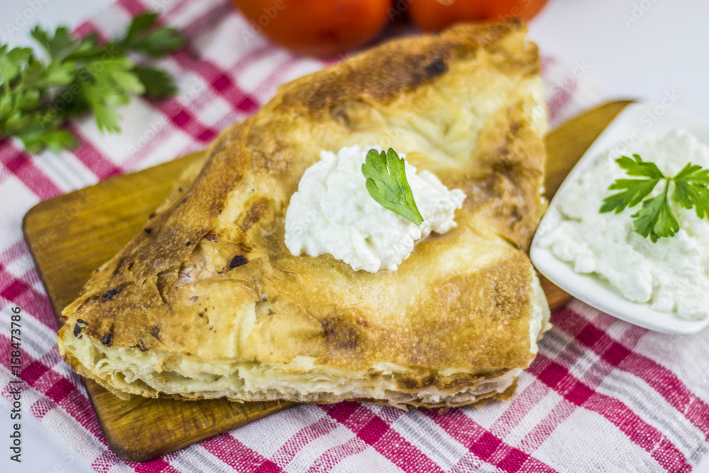 Cheese burek composition on white background