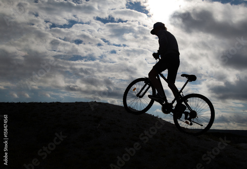 Silhouette of Mountain bike.Sport and healthy life.Extreme sports.Mountain bicycle and man.Life style outdoor extreme sport