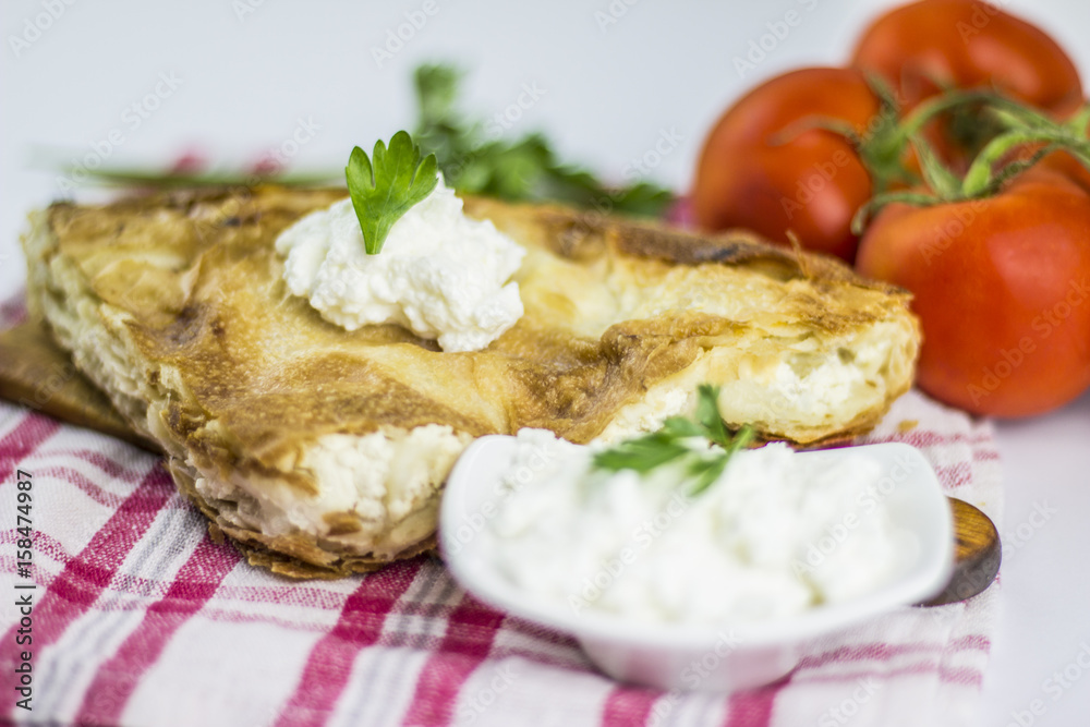 Cheese burek composition on white background