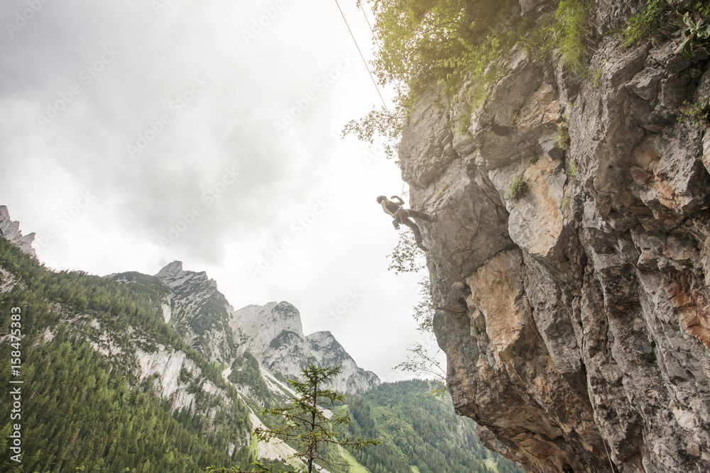 Landscape of Gosau Valley mountain with a male climber Landscape of Gosau Valley mountain with a male climber