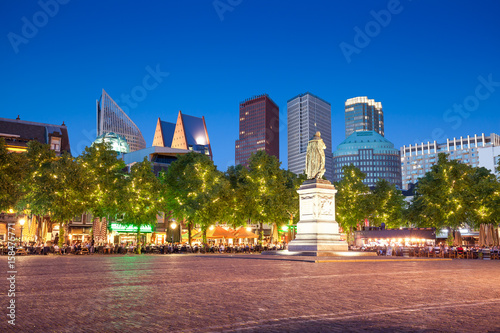 Square with William the Silent and Ministry of Security and Justice skyscraper on background on evening, The Hague © fotolupa