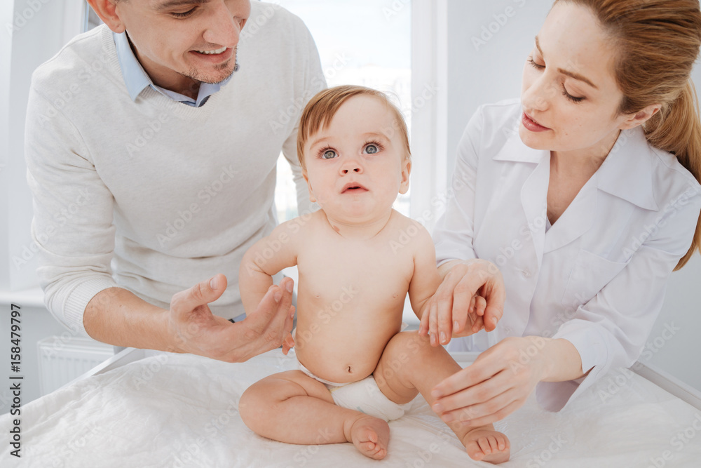 Young attentive people taking care of future generation