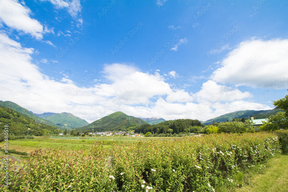 Beautiful landscape of Takayama mura at sunny summer or spring day and blue sky in Kamitakai District in northeast Nagano Prefecture Japan.