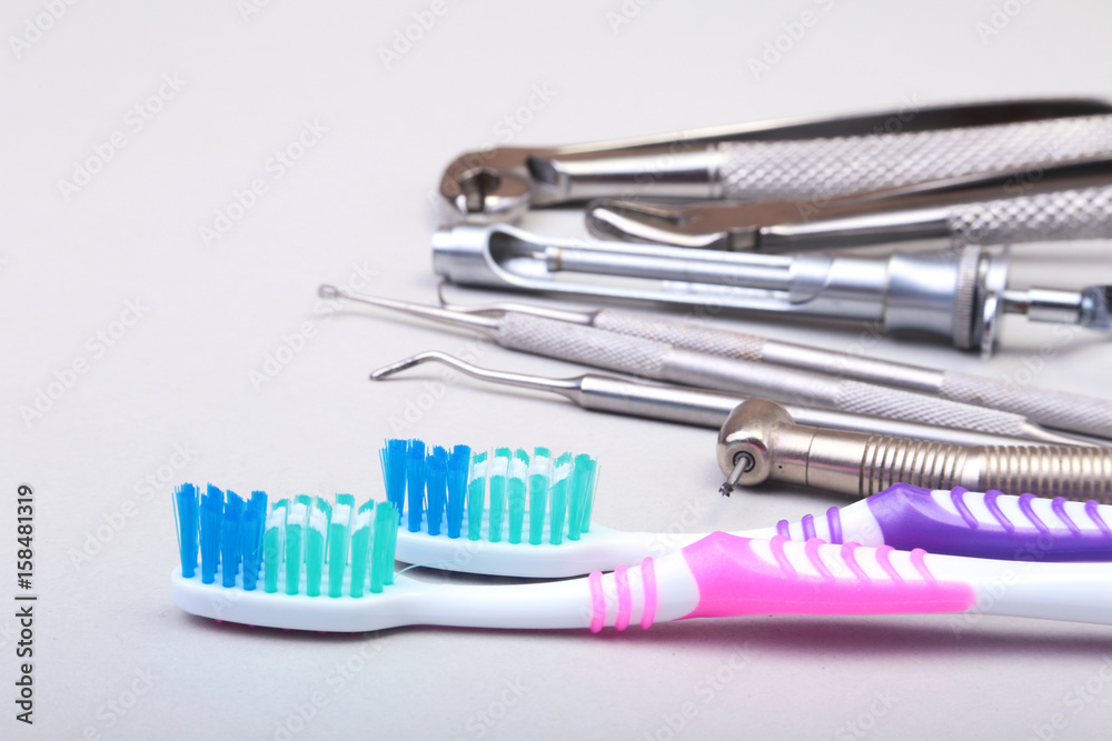 dental care toothbrush with dentist tools isolated on white background. Selective focus. dental care toothbrush with dentist tools isolated on white background. Selective focus.