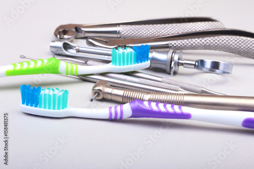 dental care toothbrush with dentist tools isolated on white background. Selective focus.