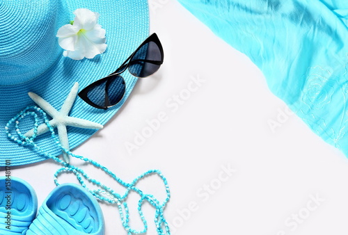 White surface with beach items, top view