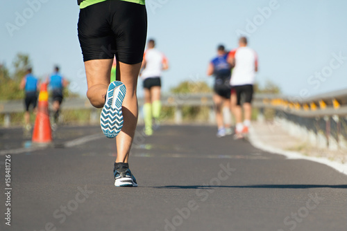 Marathon running race, people feet on  road