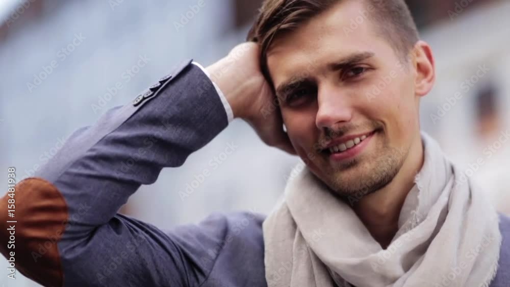 close up of happy smiling young man outdoors