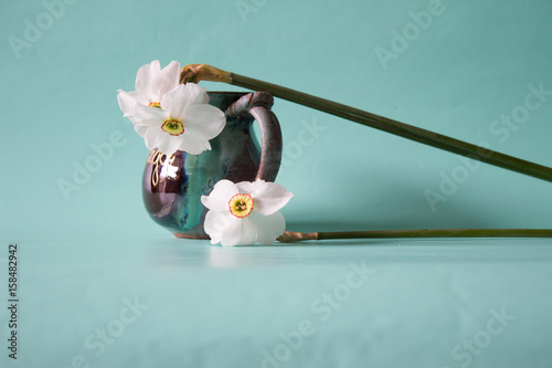 Fototapeta Naklejka Na Ścianę i Meble -  Bouquet of white daffodils in vintage vase. Spring Flower. Narcissus on neutral background. Romantic gift.